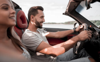 Close Upsmiling Couple Sitting Convertible Car