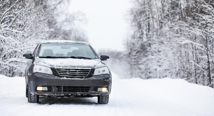 Car Stands Snow Covered Road Wintertime Cloudy Day