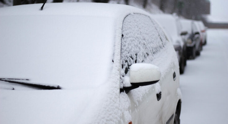 Closeup Snow Covered Car Street During Winter