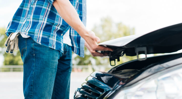 Side View Man Closing Car Hood