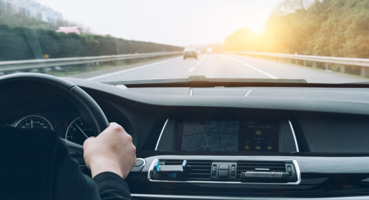 Man Driving Car From Rear View