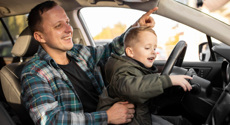 Father Son Playing With Car Wheel