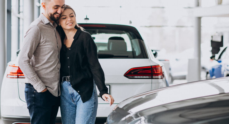 Young Couple Choosing Car Car Show Room