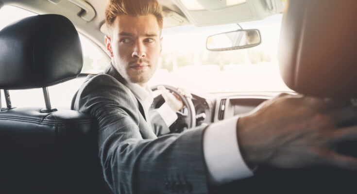 Close Up Handsome Man Driving Reverse