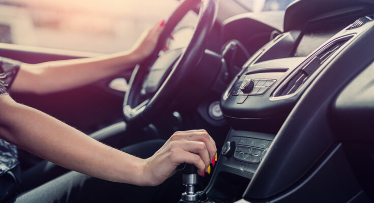 Female Driver Hand Shifting Gear Shift Knob Manually Before Beginning Ride