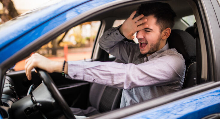 Frustrated Man Driving Car