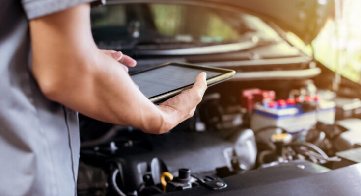 Mechanic Uses Tablet Check Engine