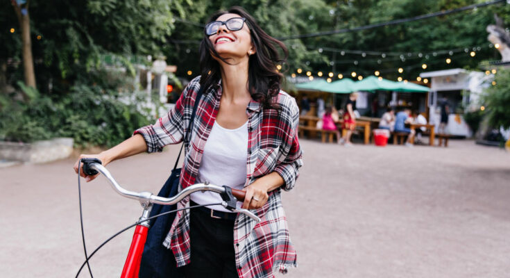 Romantic Brunette Girl Looking Up With Smile While Resting Weekend Outdoor Portrait Laughing Caucasian Woman With Bicycle